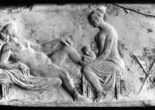 Roman relief carving of a midwife attending a woman giving birth.